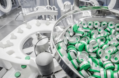 Bowl feeding system for rubber stoppers and aluminium capsules