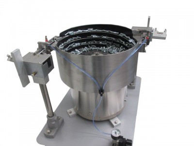 Vibrator feeding system for threaded metal inserts
