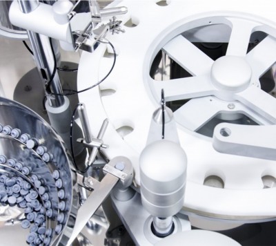 Bowl feeding system for rubber stoppers and aluminium capsules